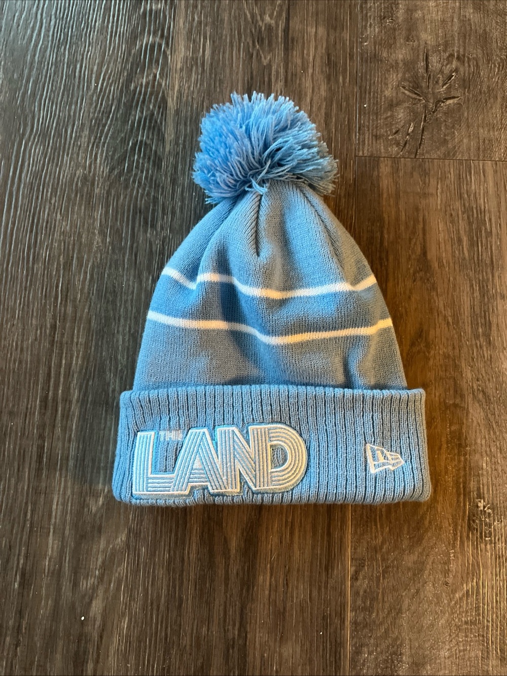New Era Cleveland Cavaliers "The Land" Knit Pom Beanie Hat NBA Logo Patch Blue